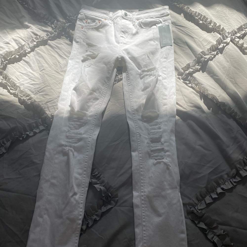 white ripped jeans
